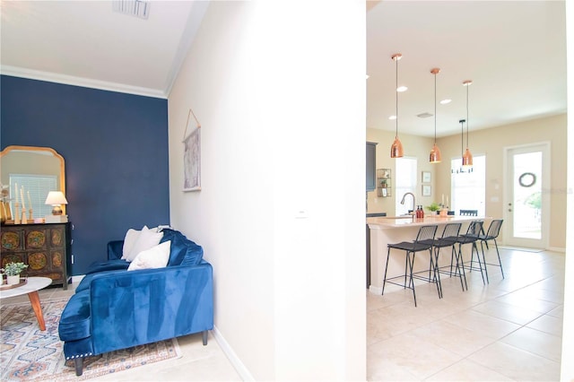 interior space featuring recessed lighting, visible vents, ornamental molding, light tile patterned flooring, and baseboards