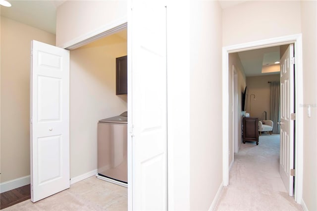 laundry room with recessed lighting, washer / clothes dryer, light colored carpet, cabinet space, and baseboards