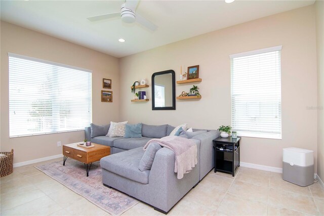 living room featuring light tile patterned floors, ceiling fan, baseboards, and recessed lighting