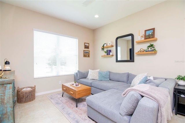 living area featuring recessed lighting, light tile patterned flooring, and baseboards