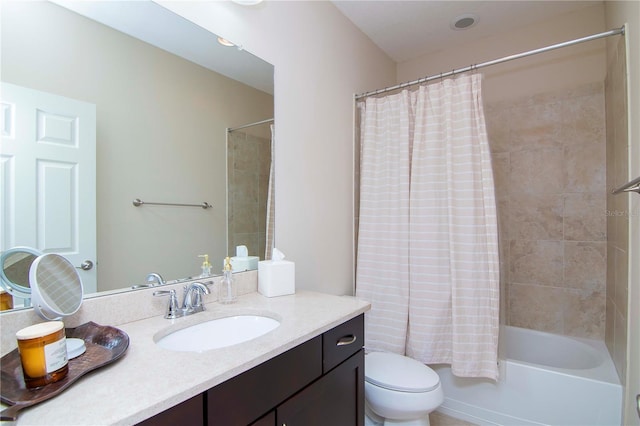 bathroom featuring shower / bath combo, vanity, and toilet