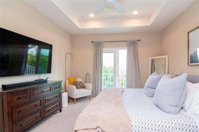 bedroom featuring a ceiling fan, recessed lighting, a raised ceiling, and light colored carpet