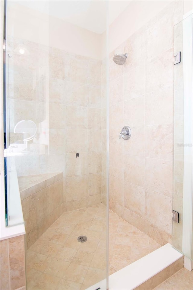 bathroom with a shower stall