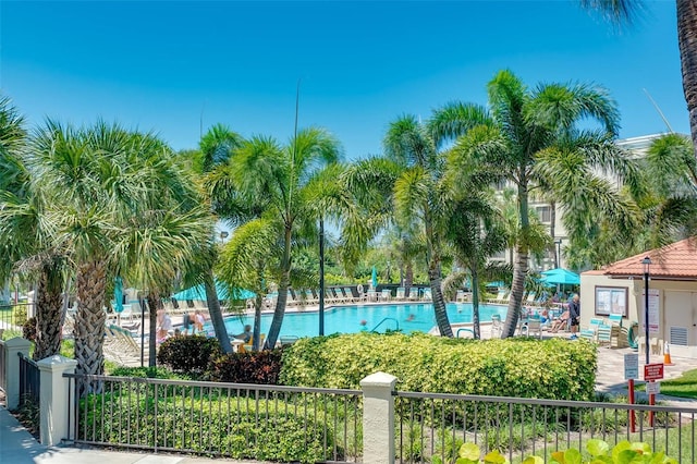 community pool featuring fence