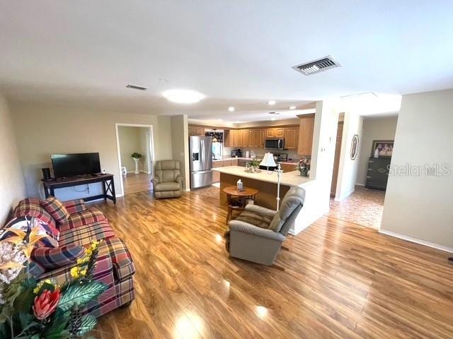 living room with light hardwood / wood-style floors