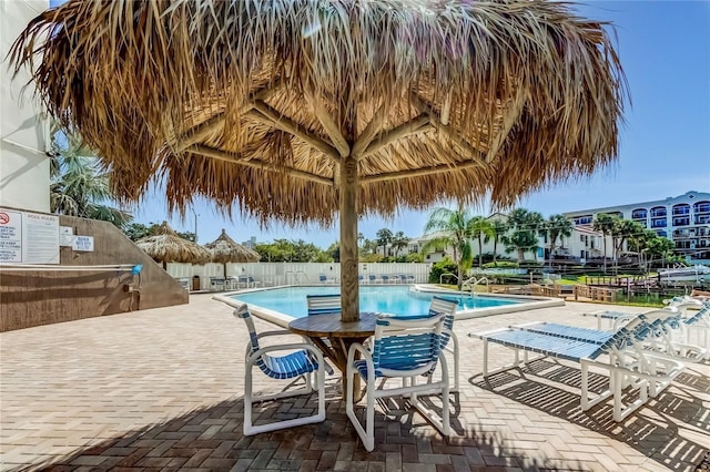 view of swimming pool with a patio