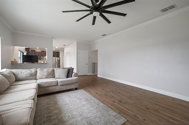 living room featuring ceiling fan, dark hardwood / wood-style flooring, and crown molding