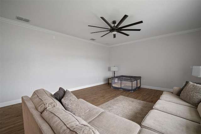 living room featuring ceiling fan, dark wood-type flooring, and crown molding