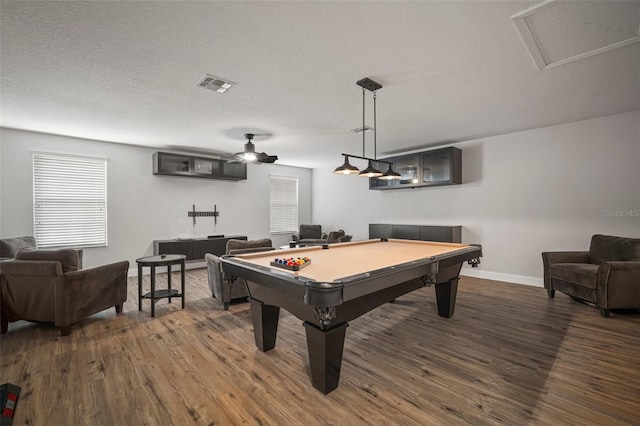 recreation room with a textured ceiling, dark wood-type flooring, billiards, and ceiling fan