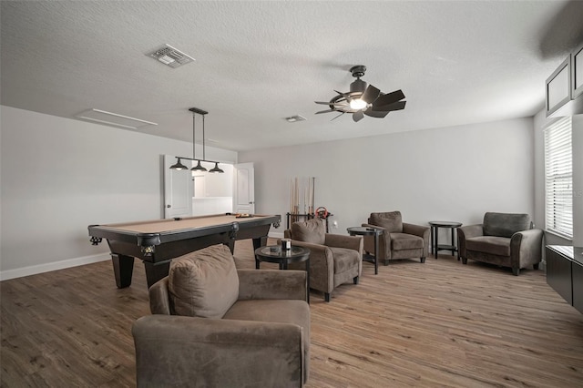 rec room featuring hardwood / wood-style flooring, a textured ceiling, billiards, and ceiling fan