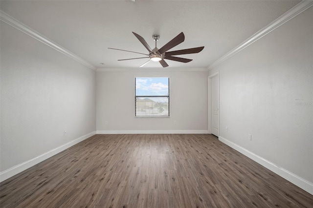 spare room featuring ceiling fan, ornamental molding, and dark hardwood / wood-style flooring