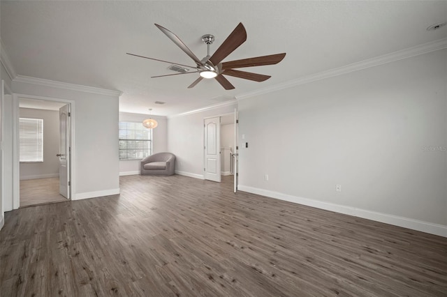 interior space with ceiling fan, dark hardwood / wood-style flooring, and ornamental molding