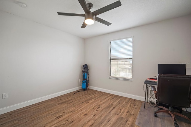 office space featuring ceiling fan and hardwood / wood-style flooring