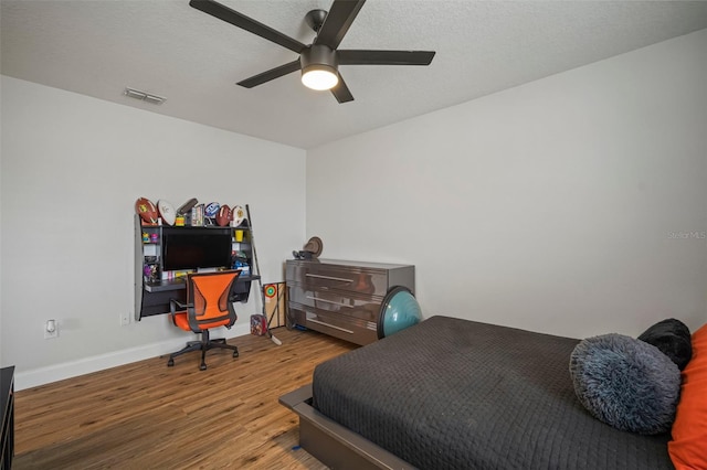 bedroom featuring ceiling fan and wood-type flooring