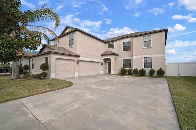 view of front property with a garage and a front yard