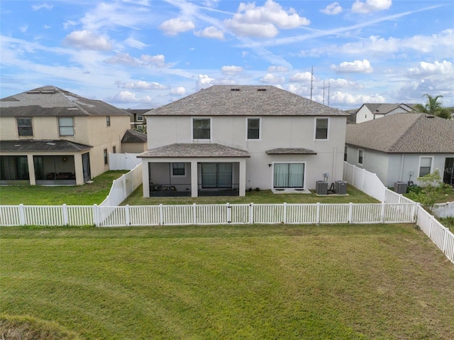 back of property featuring a yard