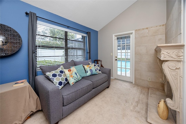 living room featuring lofted ceiling and light colored carpet