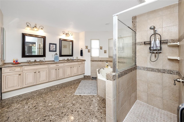 bathroom featuring vanity and shower with separate bathtub