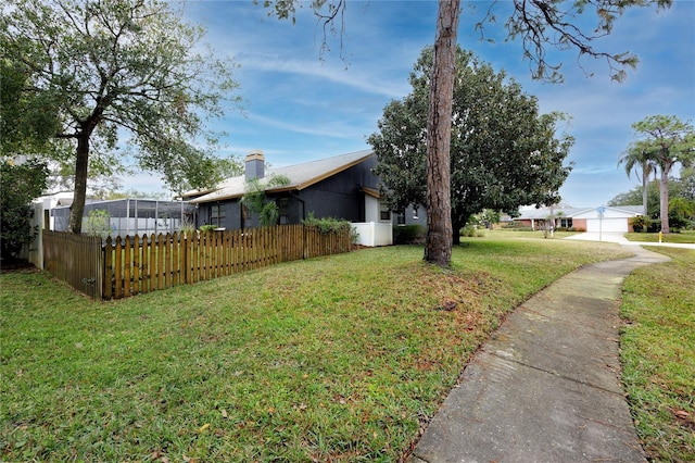 view of property exterior featuring a lawn