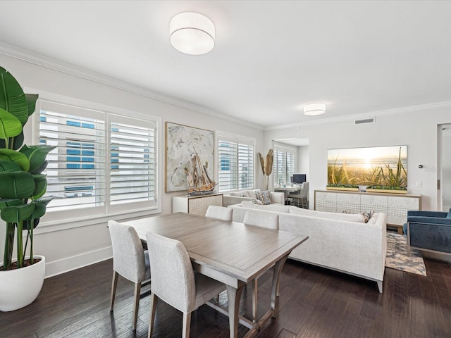 dining area featuring dark hardwood / wood-style flooring and ornamental molding