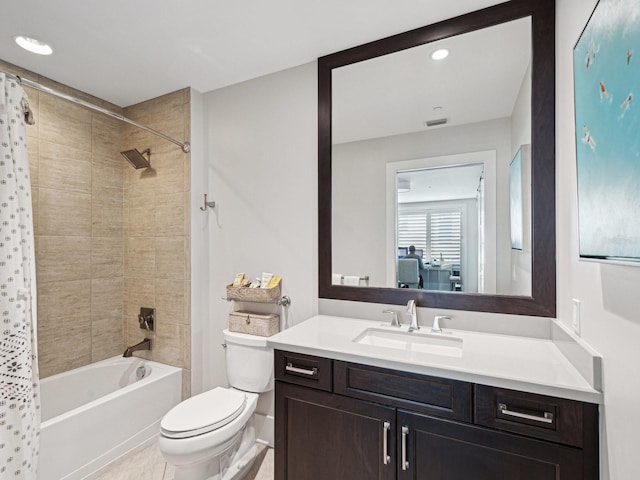 full bathroom featuring vanity, toilet, and shower / bath combo