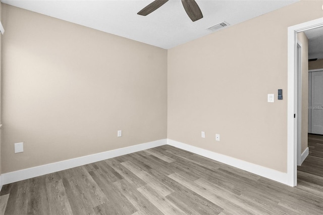 spare room featuring light wood-type flooring and ceiling fan