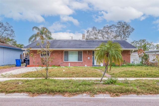 single story home featuring a front yard