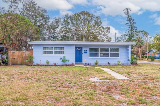 ranch-style house with a front lawn