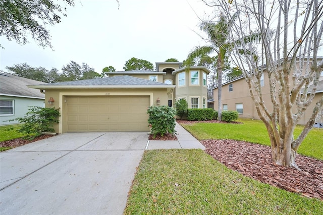 view of front of house featuring a front lawn and a garage