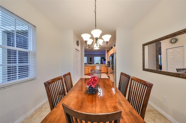 dining space featuring an inviting chandelier