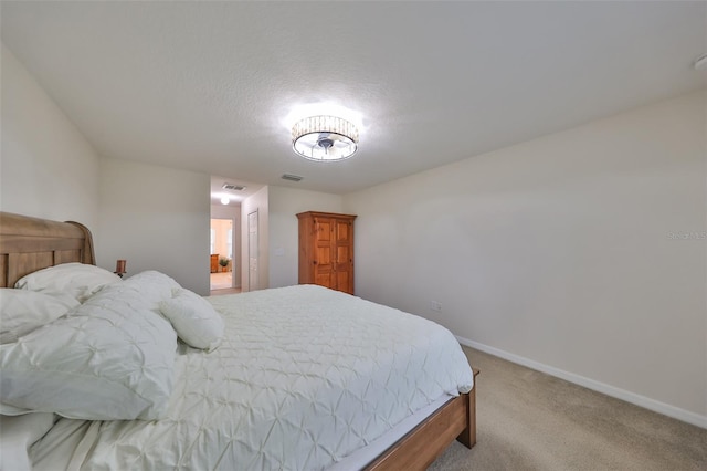 bedroom featuring light carpet