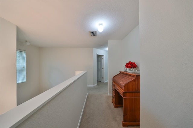 12127 Luftburrow Ln, Hudson, FL 34669 - hall with baseboards, visible vents, an upstairs landing, and carpet
