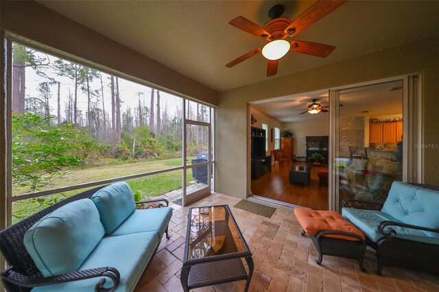 12127 Luftburrow Ln, Hudson, FL 34669 - sunroom featuring outdoor lounge area and ceiling fan
