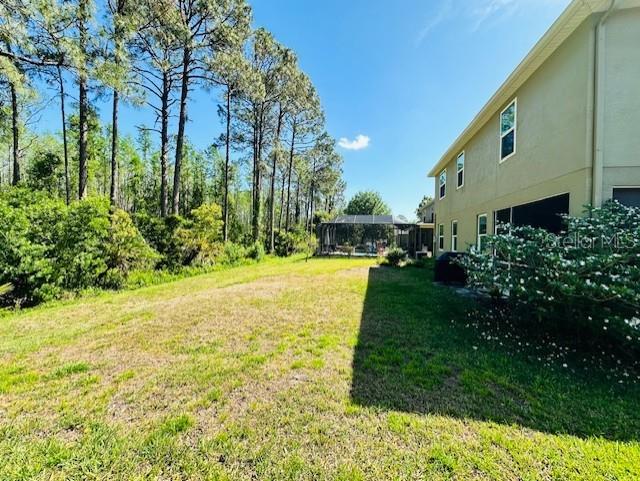 12127 Luftburrow Ln, Hudson, FL 34669 - view of yard with an attached garage