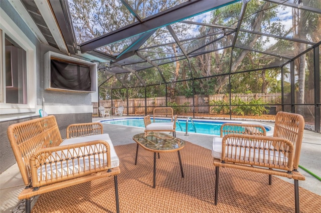 view of pool featuring a lanai and a patio