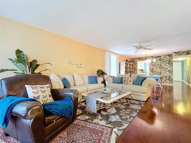 living room with ceiling fan and hardwood / wood-style floors