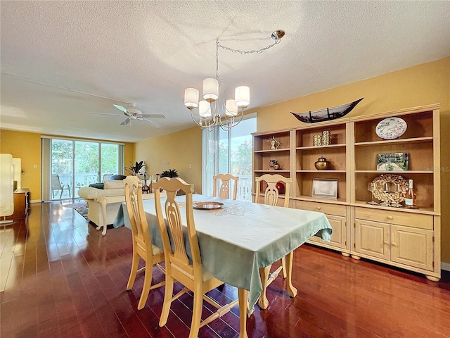 dining room with a healthy amount of sunlight, ceiling fan with notable chandelier, and a textured ceiling