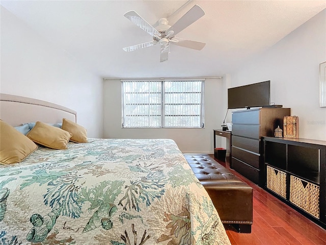 bedroom with ceiling fan and dark wood-type flooring