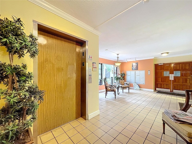 hallway featuring light tile patterned flooring, ornamental molding, a textured ceiling, and elevator