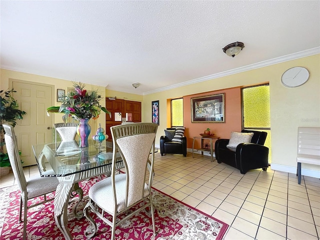 dining space featuring a textured ceiling, ornamental molding, and light tile patterned flooring