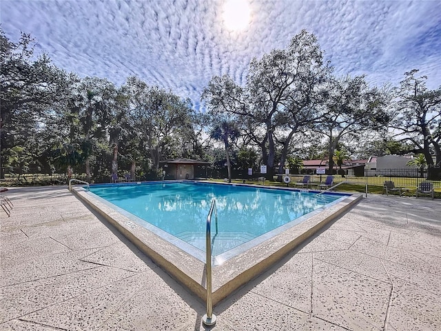 view of swimming pool with a patio area