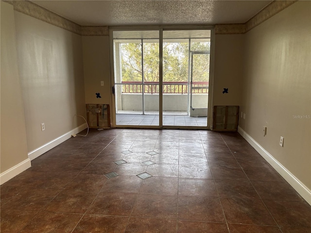 spare room with a textured ceiling