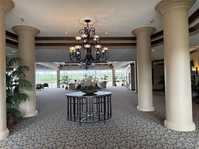 unfurnished dining area featuring an inviting chandelier, carpet flooring, and ornate columns