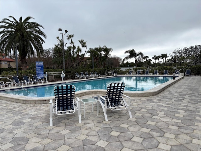 view of swimming pool featuring a patio area