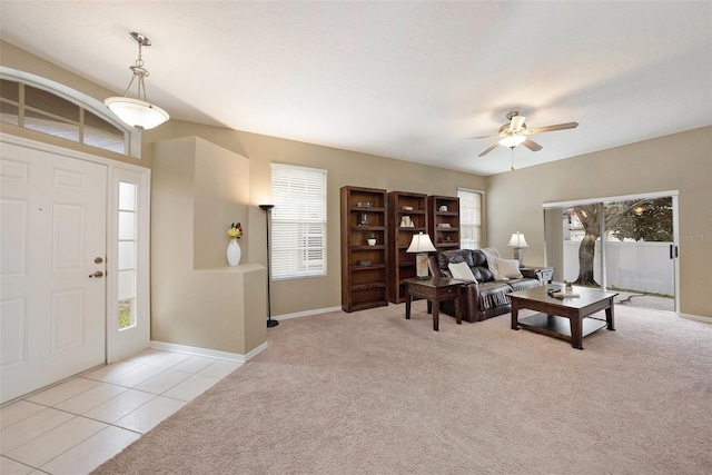 interior space featuring light colored carpet, plenty of natural light, and light tile patterned flooring