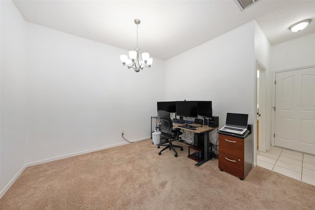 carpeted home office featuring a notable chandelier