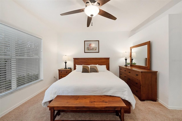 bedroom with ceiling fan and light carpet