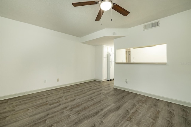 unfurnished room with ceiling fan and dark wood-type flooring