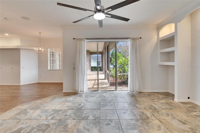 unfurnished room with ceiling fan with notable chandelier, built in shelves, and crown molding