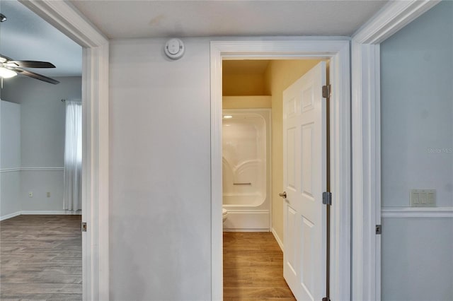 hallway with light wood-type flooring